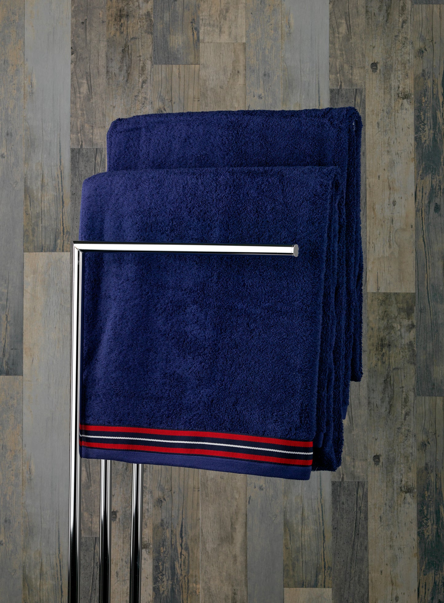 Blue pool towel with braid